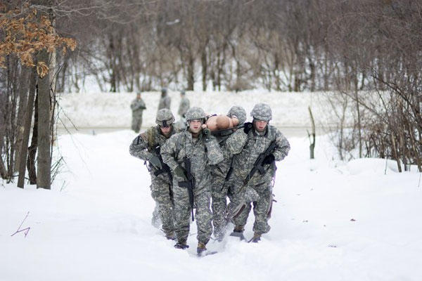 An Intelligence and Sustainment Company team races through the snow transporting a simulated casualty to a landing zone during the Gauntlet Challenge on Fort Drum, N.Y., in this file photo. (U.S. Army photo/Spc. Ferdinand Rejano)