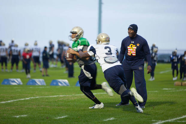 Lt. Col. Robert B. Green runs football players through drills during practice Nov. 17, 2015, at the U.S. Naval Academy in Annapolis, Maryland. (Photo: Sgt. Terence Brady)