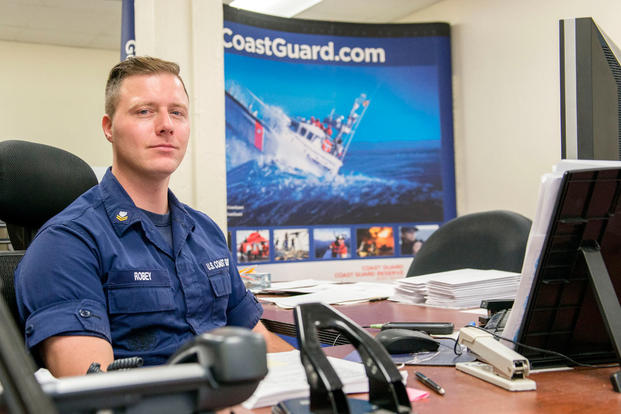 Petty Officer 2nd Class David Robey, Boston MEPS’s Coast Guard liaison, sits at his desk Thursday, Dec. 10, 2015. (Photo: Petty Officer 2nd Class Cynthia Oldham)