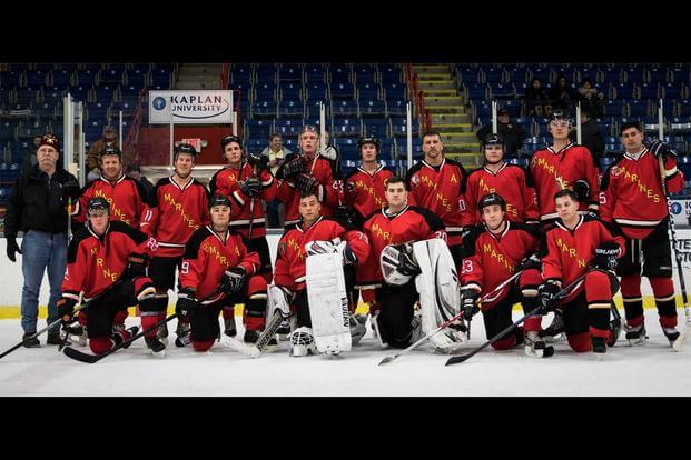 The Marine Corps Ice Hockey Team poses for a photo following first game during The Maine Event, Battle on Ice hockey tournament, Jan. 15. (Photo: Sgt. Jonathan G. Wright)