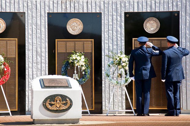 Chief Master Sgt. Martin Cortez and Maj. Emil Rebik salute the Air Force list of lost explosive ordnance disposal technicians during the 47th annual EOD Memorial Service at  Eglin Air Force Base, Fla., May 7, 2016. (U.S. Air Force photo/Samuel King Jr.)