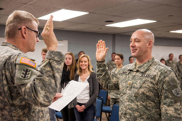 Brig. Gen. David Anderson (left), commander of the North Dakota Army National Guard, administers the oath of office to newly-promoted Maj. Dan Murphy during his promotion ceremony. (U.S. National Guard/SSgt Brett Miller)