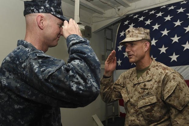 Gen. Francis Donovan, commander, Task Force 51, receives a salute from Capt. Patrick Foegduring a change of command ceremony. (Photo: Mass Communication Specialist 3rd Class Michael T. Eckelbecker)