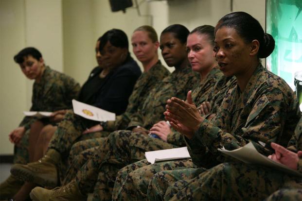 1st Sgt. Roxanne R. Collins, the first sergeant of Camp Lejeune’s Engineer Maintenance Company, 2nd Maintenance Battalion, addresses Marines at the air station’s Aerial Port of Embarkation. (Marine Corps/Pfc. Samantha H. Arrington)