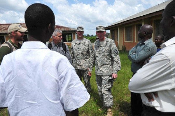 A US team along with city officials in Ganta, Liberia, survey an area for construction of an Ebola treatment unit Nov. 3, 2014. (U.S. Army photo by Sgt. 1st Class Nathan Hoskins, Joint Forces Command - United Assistance Public Affairs)