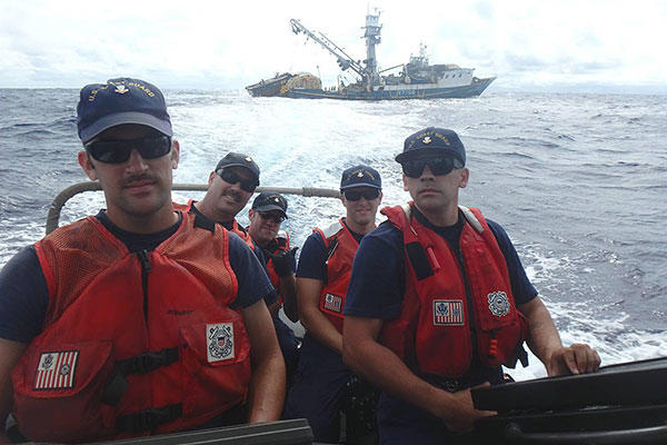 A USCGC Kukui (WLB 203) boarding team, with a shiprider from the Republic of the Marshall Islands, aboard a small boat departs the fishing vessel Lomato following a boarding in the Pacific Ocean Aug. 29, 2015. (U.S. Coast Guard photo)