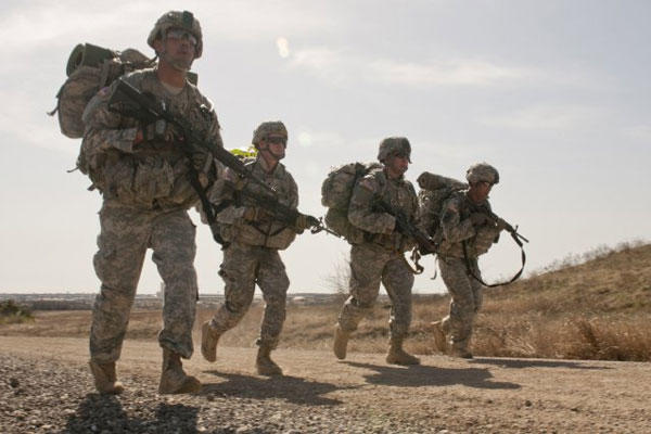 Soldiers from 3rd Cavalry Regiment run to the finish line of a four-mile road march held March 20 at Fort Hood. (U.S. Army Photo by Sgt. Samuel Northrup)