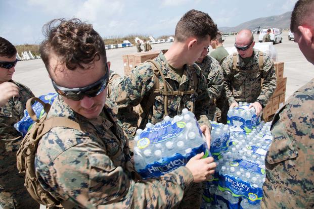 U.S. Marines with the 26th Marine Expeditionary Unit (MEU), unload emergency care items at the St. Thomas Cyril E. King Airport, U.S. Virgin Islands, Sept. 12, 2017. (U.S. Marine Corps/Lance Cpl. Alexis C. Schneider)