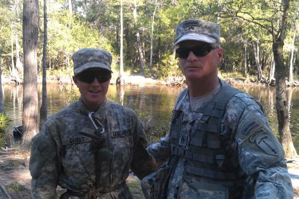 Timothy Spayd, 54, a former Army Ranger who has amyotrophic lateral sclerosis (ALS), takes a photo with Capt. Kristen Griest, one of the first two women in history to complete Ranger School, while volunteering with the swamp phase in Florida in 2015.