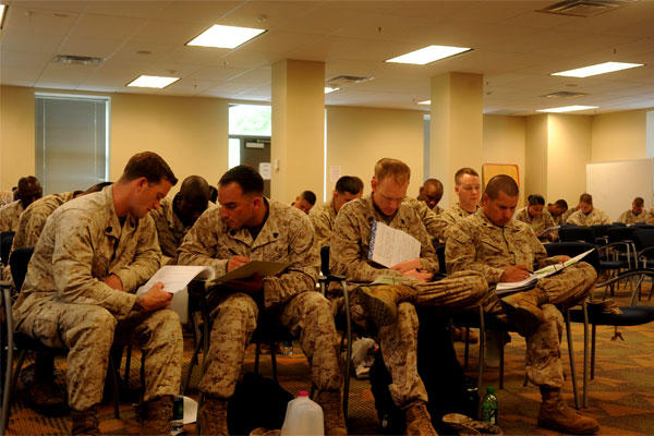 Marines take a test in completion of a chaser course at Marine Corps Base Quantico in May 2013. Chasers are certified Marines who work with various types of people, including those going to and from the brig. (US Marine Corps photo)