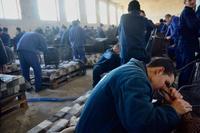 Russian prisoners of war build patio furniture