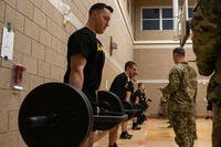 A group of challengers lift weights for the modified Army Combat Fitness Test on the first day of the 2024 New Hampshire Army National Guard Best Warrior Competition.