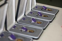 Purple Heart Medals are displayed on a table.