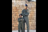 Roger Fortson poses with his sister in matching flight suits.