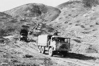 A truck supply convoy heads toward the Mu Gia pass into Laos along Route 12 in the Ha Tinh province of Vietnam in 1968.