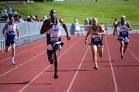 Army Staff Sgt. Derrick Thompson competes in the men's 200-meter sprint during the track event at the 2025 Department of Defense Warrior Games in Colorado Springs, Colorado, July 23, 2025. (Spc. Samuel Signor/Army) Sprinters on a track.