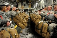 Army National Guard Soldiers wait in the cargo hold of a C-17 Globemaster III cargo aircraft before taking off for a training jump Jan. 23, 2015, in Austin, Texas. (U.S. Air Force photo/Airman 1st Class Nathan Clark)