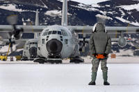 An LC-130 Hercules is marshaled from its parking spot on the annual sea ice runway near McMurdo Station, Antarctica, during Operation Deep Freeze. Tech. Sgt. Shane A. Cuomo/Air Force