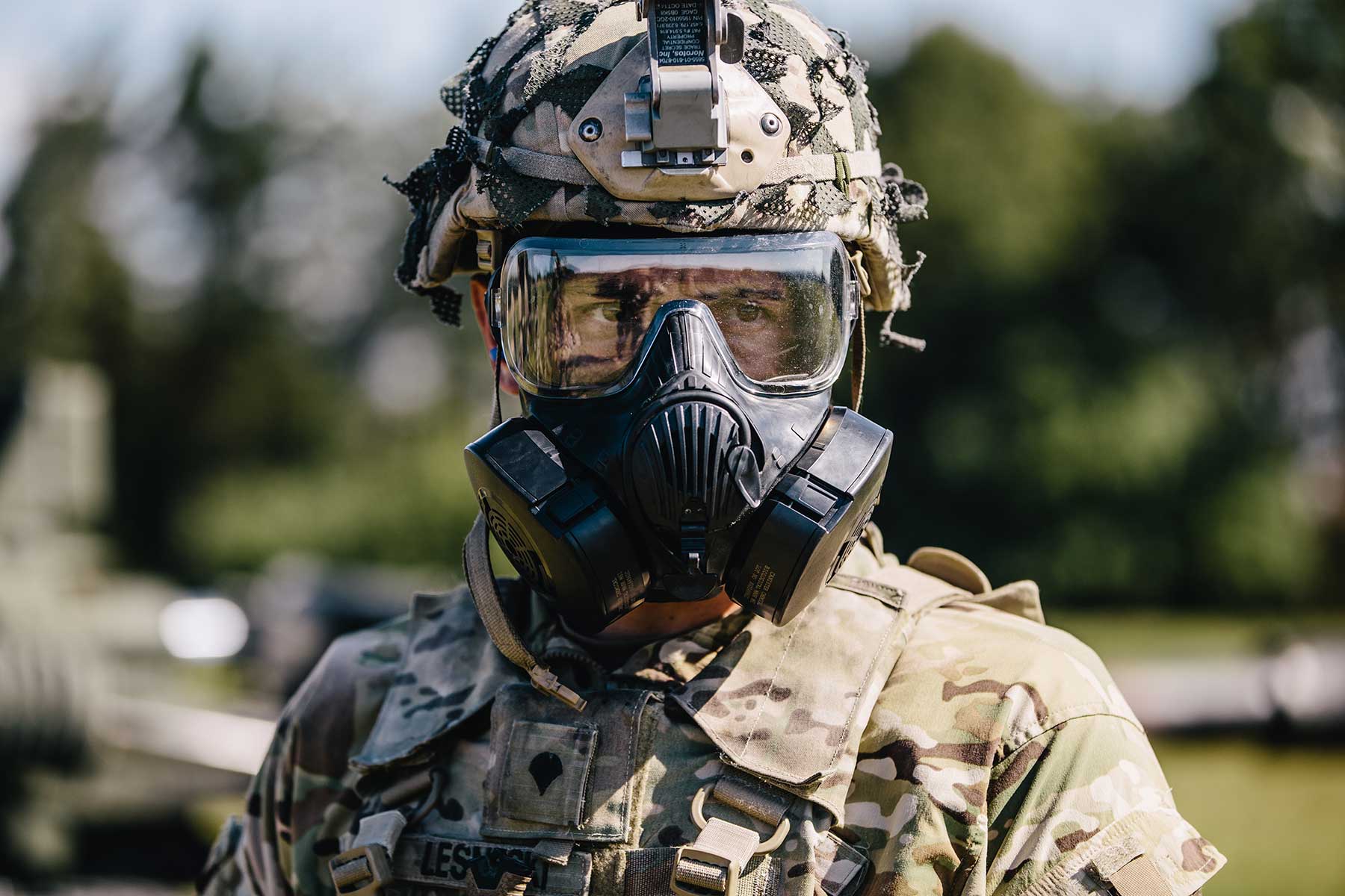 A U.S. Army paratrooper dons MOPP gear after the call of "gas, gas, gas."