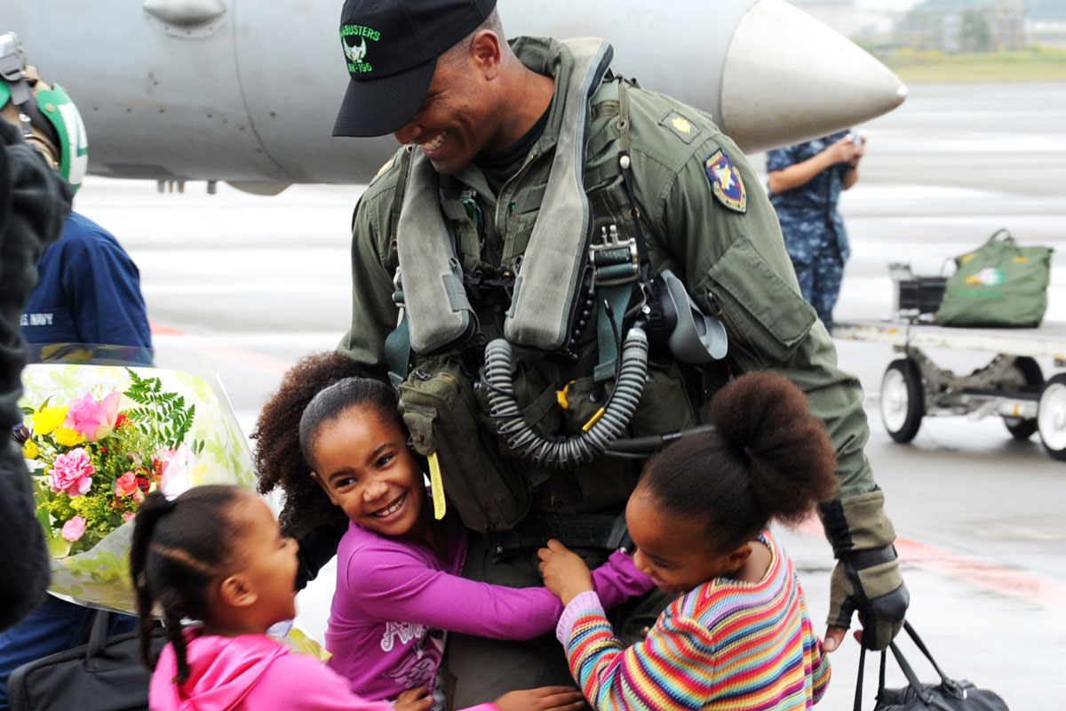 U.S. Navy Lt. Cmdr. Greets Daughters