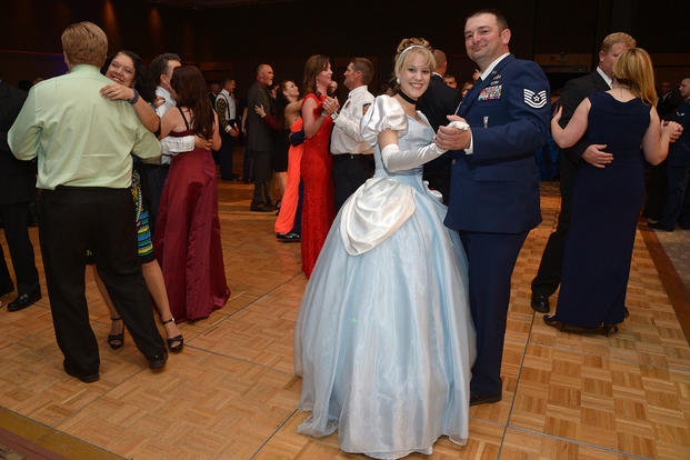 Ali Arbuckle, dressed as Cinderella, and her date retired Tech. Sgt. Rudolf Horak dance during the Hill Air Force Base Air Force Ball. (U.S. Air Force/Alex R. Lloyd) 