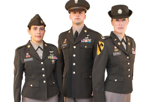 Early prototypes of the ‘Pinks and Greens’ uniform under consideration for all soldiers. The final version, due out in December, will feature a belted jacket and brown leather shoes. (Army Photo)