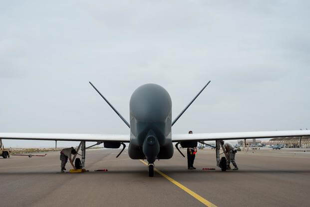 A maintenance crew secures an RQ-4 Global Hawk on a runway after completing a sortie in support of Operation Inherent Resolve at an undisclosed location in Southwest Asia on Feb. 20, 2017. Senior Airman Tyler Woodward/Air Force