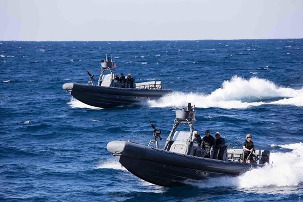 Two 11-meter Navy Special Warfare Rigid Hull Inflatable Boats transit to the amphibious transport dock ship USS New York to pick up Marines for a visit board search and seizure drill in the Atlantic Ocean on Nov. 25, 2017. Mass Communication Specialist 2nd Class Lyle Wilkie/Navy
