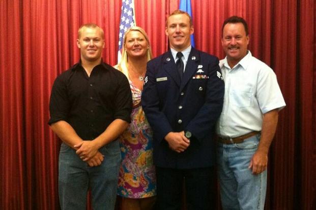 Staff Sgt. Christopher Lewis poses with his family. (Courtesy Air Force/Lewis family)