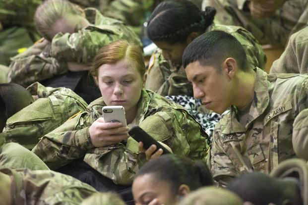 Trainees check their cell phones and update their family members at the Solomon Center on Fort Jackson Dec. 18, 2017. (Fort Jackson Public Affairs Office/Robert Timmons)