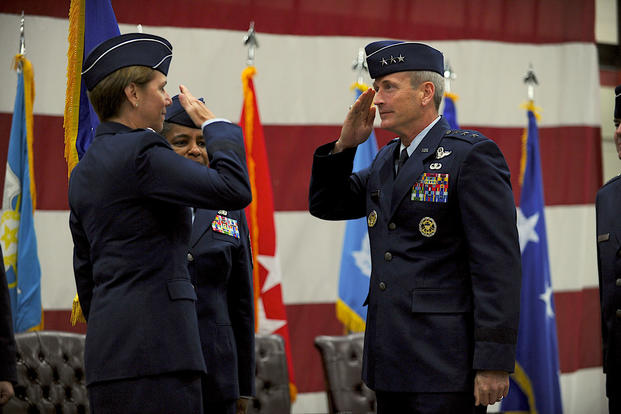 Then Lt. Gen. Terrence J. O'Shaughnessy salutes Gen. Lori Robinson, Pacific Air Forces commander, symbolically accepting command of Seventh Air Force during a change of command ceremony at Osan Air Base Dec 19, 2014. (U.S. Air Force photo/John Ross)