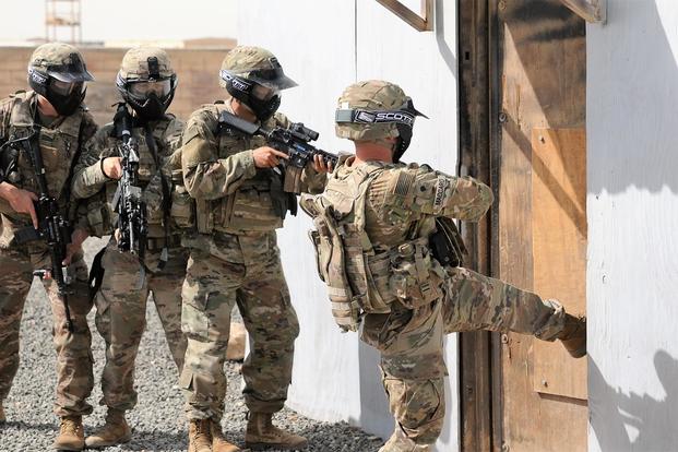 Soldiers of Alpha Company, 1st Battalion, 6th Infantry Regiment conduct a breaching operation, at the U.S. Army Central Command Readiness Training Center located at Camp Buehring, Kuwait, March 20, 2018. (U.S. Army/Sgt. 1st Class Charles Highland)