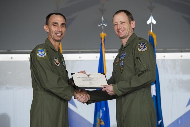  U.S. Air Force Maj. Gen. Scott J. Zobrist, left, 9th Air Force commander, presents Maj. Matthew “Chowder”’ Cichowski, 74th Fighter Squadron A-10C Thunderbolt II pilot, with a Distinguished Flying Cross with valor during an award ceremony on May 23, 2018, at Moody Air Force Base, Ga. (U.S. Air Force photo by Senior Airman Janiqua P. Robinson)