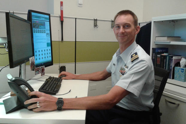 Coast Guard Lt. Cmdr. Matt Walter, in his office at Coast Guard headquarters in Washington, is one of only 2,738 people to have earned an international emergency management credential. (Coast Guard photo/Walter Ham)