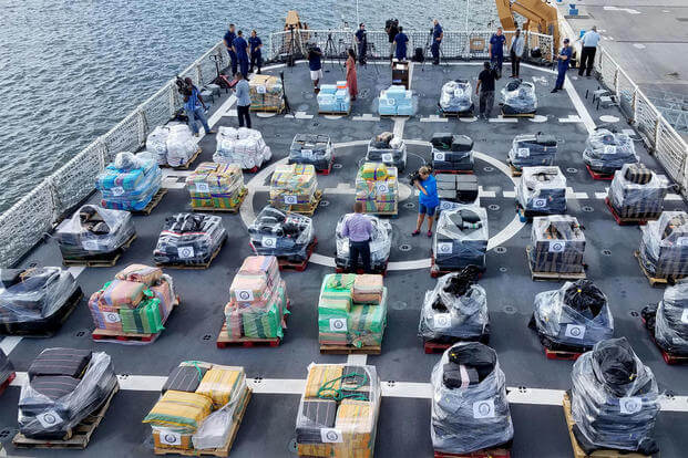  About 18 tons of cocaine are stacked on the deck of U.S. Coast Guard cutter Hamilton in May 2017. The drugs were seized off Central and South America. (US Navy photo/Luke Clayton)