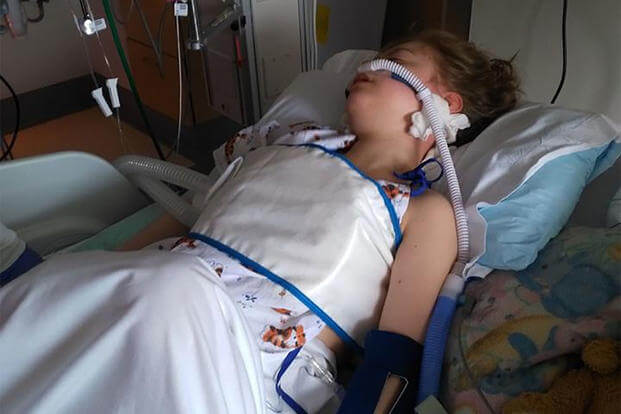 Lorelei McIntyre-Brewer, 13, lays unconscious after going into septic shock in the spring of 2018. (Courtesy of Chelle McIntyre-Brewer)