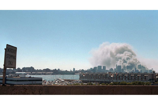 <em>Smoke from ground zero as seen from across the Hudson River (George W. Bush Presidential Library)</em>