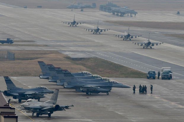 U.S. Air Force F-16 Fighting Falcon fighter aircraft, assigned to the 36th Fighter Squadron, participate in an elephant walk during Exercise VIGILANT ACE 18 at Osan Air Base, Republic of Korea. (U.S. Air Force photo/Franklin R. Ramos)