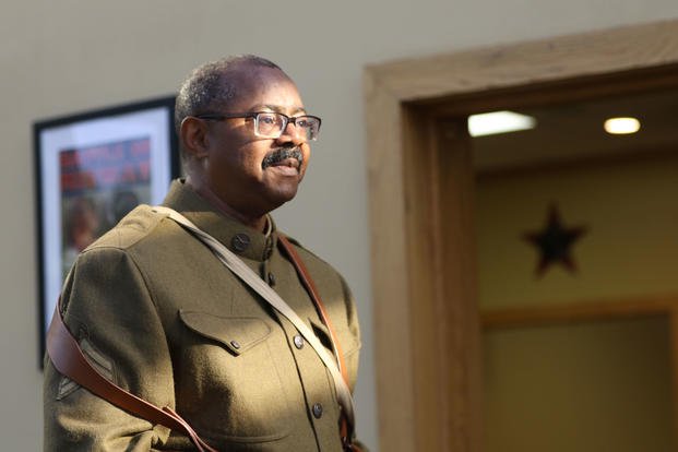 Perry James, wearing the uniform of an American Soldier during World War I, speaks about the efforts of African-American Soldiers during the war at a breakfast for military retirees July 26, 2018 at Fort Jackson's NCO Club. His grandfather, Perry Loyd, was a veteran of World War I. (U.S. Army photo/Wallace McBride)