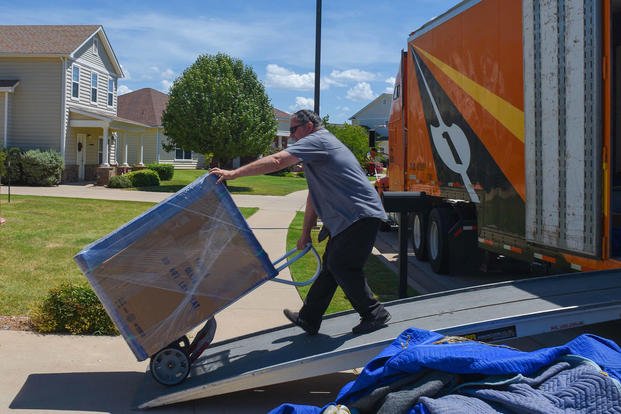 A civilian contractor unloads boxes of home goods at Dyess Air Force Base, Texas, Aug. 29, 2018. (U.S. Air Force photo/Kylee Thomas)
