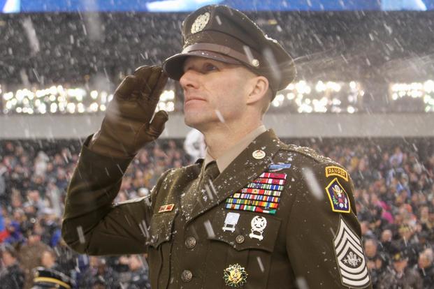 Sergeant Major of the Army Dan Dailey, wearing the Army's then-proposed 'Pink and Green' daily service uniform, salutes the Anthem pre-kickoff during the Army-Navy game at Lincoln Financial Field in Philadelphia on Dec. 9, 2017. (U.S. Army/Ronald Lee)