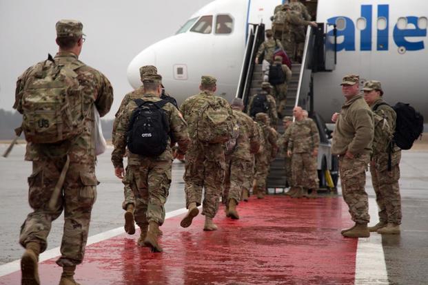 FILE -- Soldiers from 151st Regional Support Group, Massachusetts National Guard board an aircraft destined for Fort Hood, Texas here Jan. 23, 2018. The citizen-soldiers are scheduled to deploy to Kuwait in support of Operation Spartan Shield. (US Army photo by Spc. Samuel D. Keenan)
