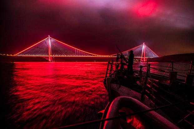 Sailors man a .50-caliber machine gun aboard the USS Carney as the guided missile destroyer ship travels in the Bosporus, Feb., 17, 2018. The Carney is supporting U.S. national security interests in Europe and regional allies and partners. Navy photo by Petty Officer 2nd Class James R. Turner