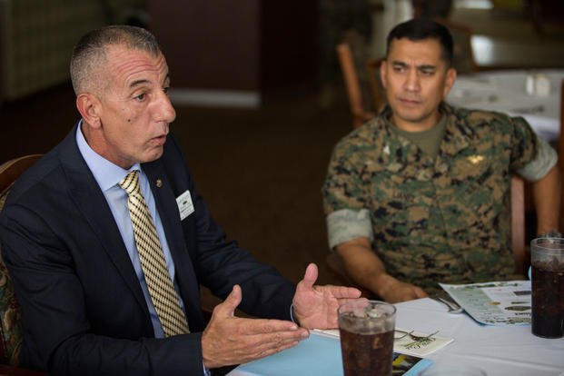B.J. Lawrence, the senior vice commander-in-chief for the Veterans of Foreign Wars (VFW) organization, speaks with Col. Raul Lianez, commanding officer, Marine Corps Base Hawaii and other senior MCBH leaders, Mar. 14, 2018. (U.S. Marine Corps photo/Jesus Sepulveda Torres)