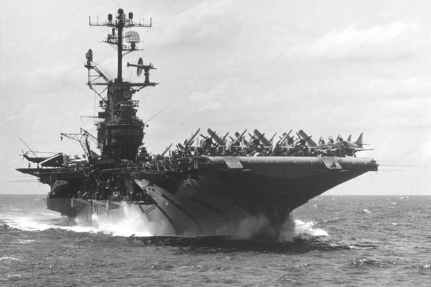 The U.S. Navy aircraft carrier Intrepid (CVS-11) steams in the South China Sea on Sept. 13, 1966, with aircraft of Attack Carrier Air Wing 10 (CVW-10) parked on the flight deck. CVW-10 was assigned to the Intrepid for a deployment to Vietnam from April 4 to Nov. 21, 1966. V.O. McColley/Navy