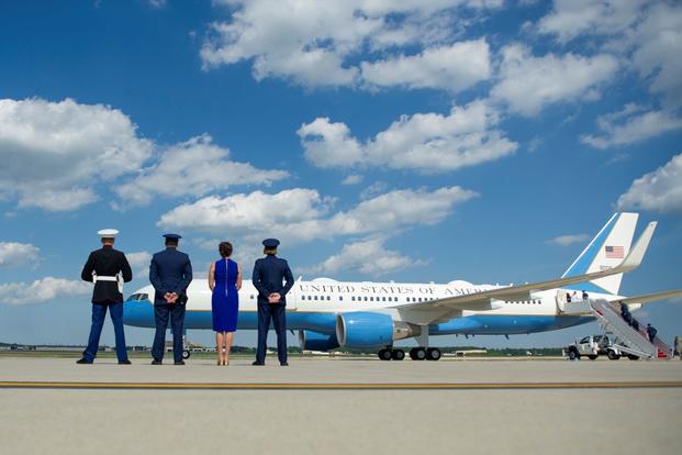 The official greeting party stand by on the flightline as the president, first lady and their family depart on Air Force One from Joint Base Andrews, Md., June 29, 2018. (Tech. Sgt. Robert Cloys/U.S. Air Force)
