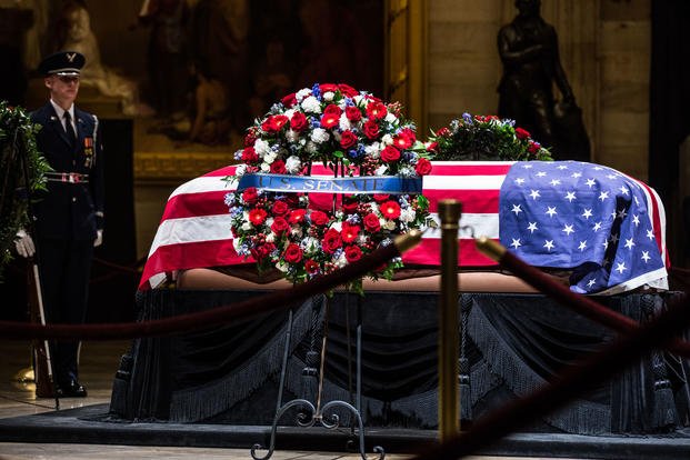 A United States Air Force Honor Guard service member, guards the casket of George H.W. Bush, the 41st President of the United Sates, at the U.S. Capitol, Washington D.C., December 4, 2018. (DoD photo/Noel Diaz)