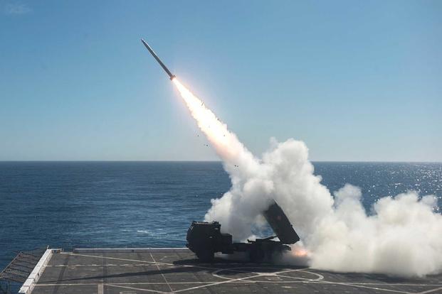 The High Mobility Artillery Rocket System (HIMARS) is fired from the flight deck of the amphibious transport dock ship USS Anchorage (LPD 23) during Dawn Blitz 2017 over the Pacific Ocean on Oct. 22, 2017. (U.S. Navy photo by Mass Communication Specialist 2nd Class Matthew Dickinson)