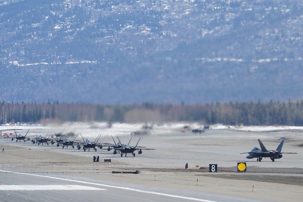 F-22 Raptors from the 3rd Wing and 477th Fighter Group participate in a close formation taxi, known as an Elephant Walk, March 26, 2019, during a Polar Force exercise at Joint Base Elmendorf-Richardson, Alaska. (U.S. Air Force photo/Justin Connaher)