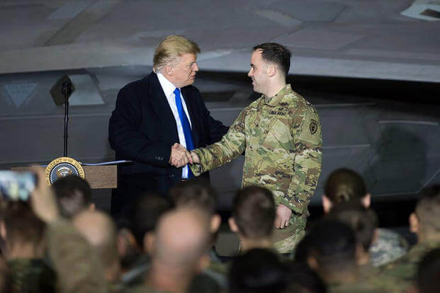 President Donald Trump recognizes U.S. Army Sgt. Sean Rogers, U.S. Army Bronze Star recipient, for his heroic actions during a deployment, at Joint Base Elmendorf-Richardson, Alaska, Feb. 28, 2019. The President was at the base to meet with service members after returning from a summit in Hanoi, Vietnam. (U.S. Air Force photo/Westin Warburton)